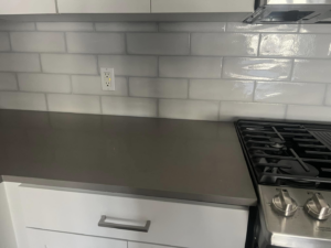 Clean kitchen countertop and subway tile backsplash installed by Fox Solutions Corp in Worcester, MA