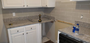 Kitchen countertop and tile backsplash installation by Sanchez Construction in Weimar, TX