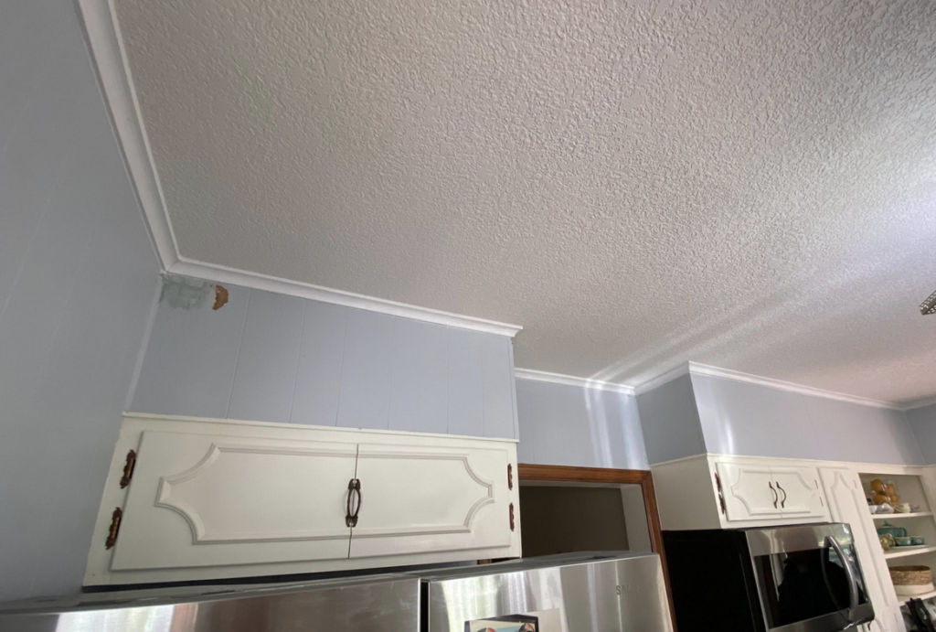 Detailed view of kitchen crown molding installation by Blackbird Custom Carpentry in Kansas City, MO.