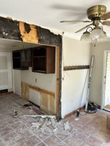 A kitchen undergoing demolition and renovation, showing a wall removed, by Lay's Remodeling LLC in El Paso, TX