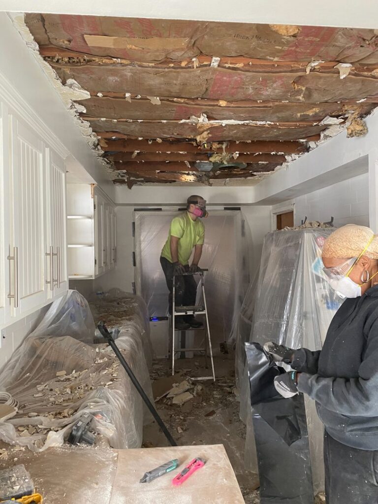 Handymen from Handy Fix Co. performing kitchen demolition and renovation preparation in Cleveland, OH.
