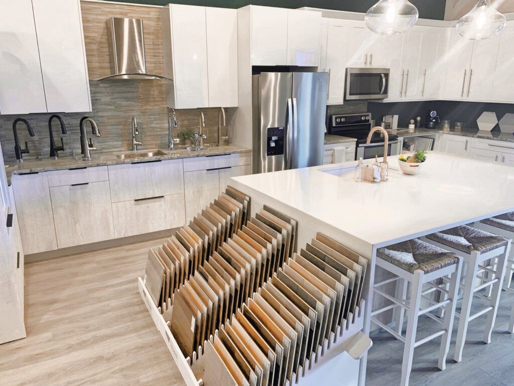 A kitchen design showroom with material samples, assisting clients of Coastal Pointe Homes in Tampa, FL.
