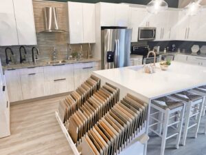 A kitchen design showroom with material samples, assisting clients of Coastal Pointe Homes in Tampa, FL.