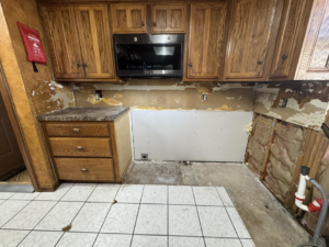 Partial drywall installation in a kitchen during a renovation project by JM Renovations LLC in Moore, OK.