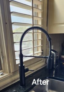 A new black pull-down kitchen faucet installed, showing a completed plumbing upgrade by Go Joe Handyman in Overland Park, KS.