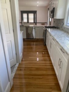 Modern kitchen with newly finished hardwood floor by Diamond Flooring LLC in Boston, MA