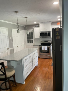 A renovated kitchen island with drawers and modern appliances by Blue Ribbon Renovations in Elizabethtown, KY.