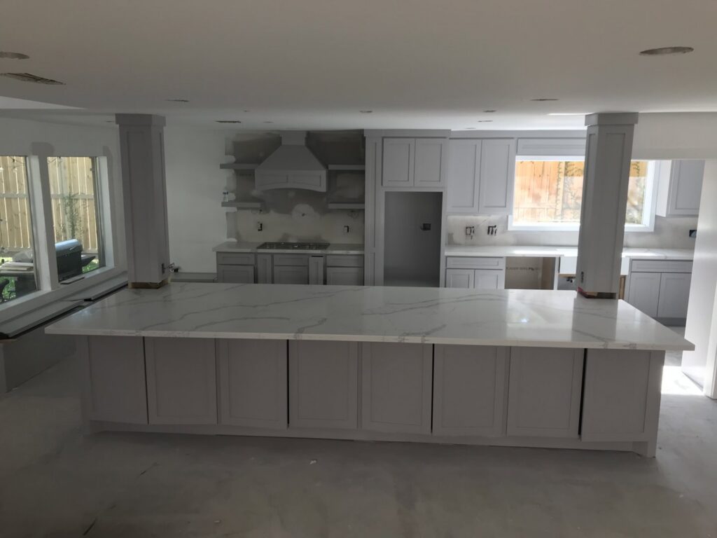 Kitchen island and cabinet installation in progress during a remodel by SRP construction in Houston, TX