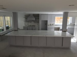 Kitchen island and cabinet installation in progress during a remodel by SRP construction in Houston, TX