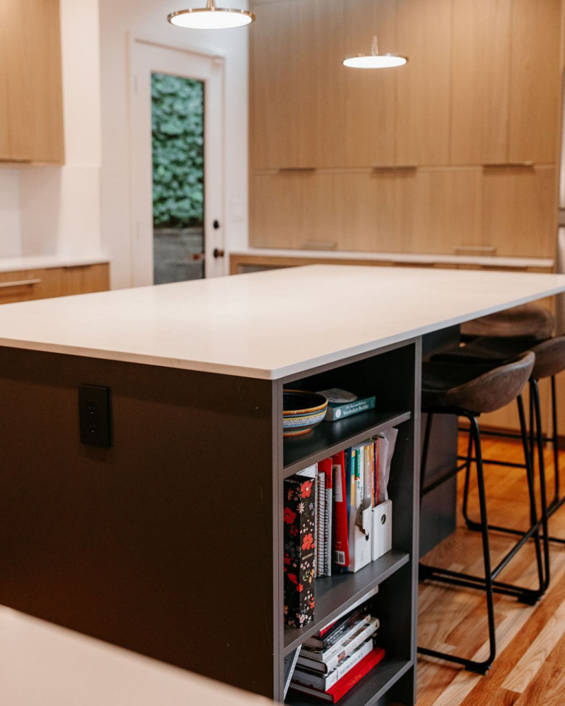 Kitchen island with a new countertop and custom open shelving installed by Atlantic Tile & Granite in Kent, WA.