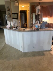 Kitchen island with new drywall installation in progress by Vargas Paint and Texture in San Antonio, TX.