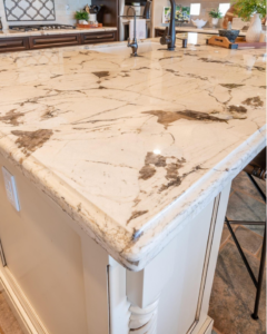 A close-up of a newly installed kitchen island with a beautiful marble or granite countertop by Accent Marble & Granite, Inc in Phoenix, AZ