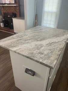 Kitchen island with a new countertop installation by Sanchez & Hall Construction in Richmond, VA.