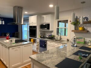 Kitchen island and range hood installation by Cabido Design, a professional handyman in Brentwood, MD.