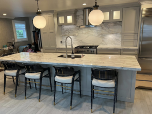 Spacious kitchen island with a beautiful stone countertop installed by Dream Stone Countertops in Norfolk, VA