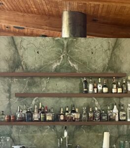 A large kitchen island with a newly installed stone countertop, showing the work in progress by Oddonetto Granite & Marble LLC in Phoenix, AZ.