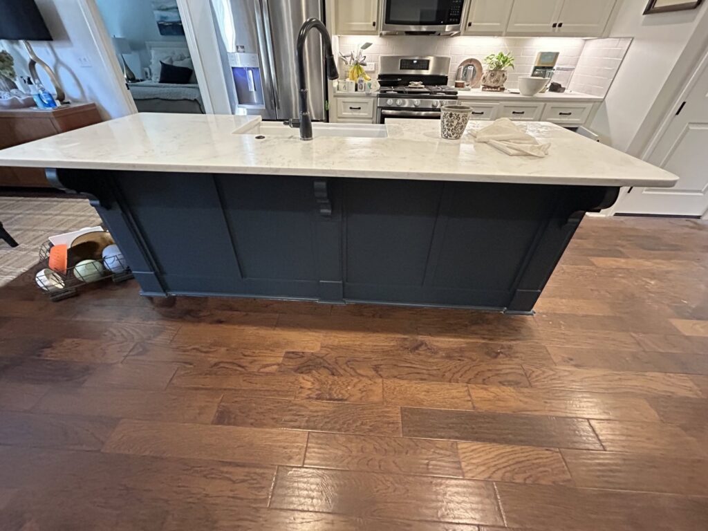 A newly installed kitchen island with a sink and faucet by BK's Handyman Services in Carlton, OR.