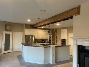 Kitchen and living area open concept conversion by Load Bearing Wall Pros in Plano, TX, with structural work visible.