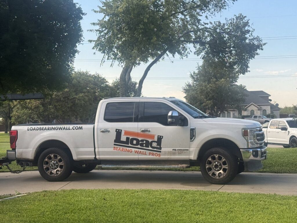 Kitchen and living room wall removal project by Load Bearing Wall Pros in Plano, TX, showing structural modifications.
