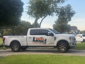 Kitchen and living room wall removal project by Load Bearing Wall Pros in Plano, TX, showing structural modifications.