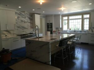 Kitchen marble countertop and backsplash installation in progress by Art of Stone Shop in Bridgeport, CT.