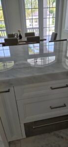 A close-up of a beautifully polished marble countertop in a kitchen, a service provided by Cornerstone Services Management in Miami, FL.