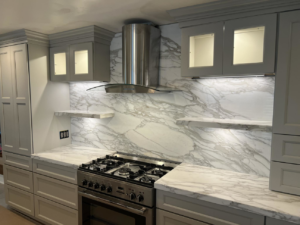 Modern kitchen featuring new marble countertops and backsplash installed by Dream Stone Countertops in Norfolk, VA