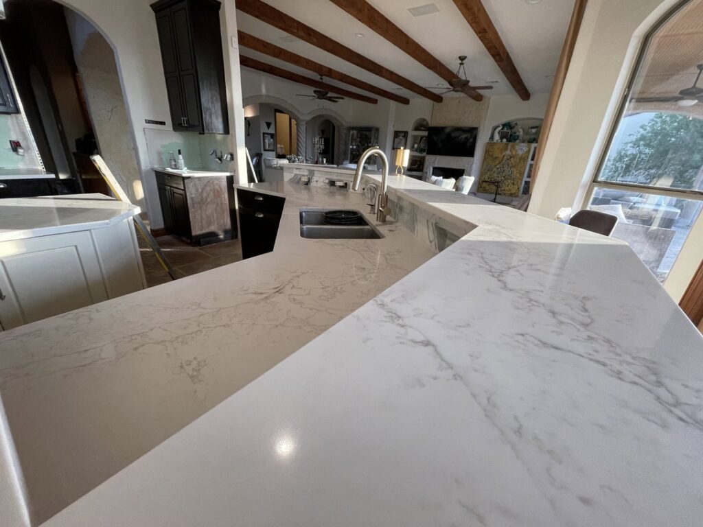 New white marble-look countertops installed in a kitchen by R and R contractors in Rogers, AR.