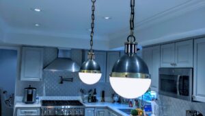 Newly installed kitchen pendant lights and recessed lighting by AES Electrical Contractor in Richmond, VA.