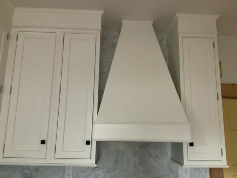 Newly installed kitchen range hood and white cabinets by Balance Painting & Remodeling, LLC in Portland, OR.
