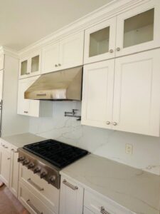 A kitchen featuring a newly installed range and matching range hood by R&J Handyman Services LLC in Warwick, RI.