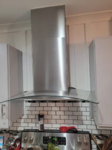 Professional installation of a kitchen range hood and subway tile backsplash by Gonzalez Services Corp. in Nashville, TN.