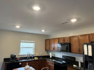 A kitchen with newly installed recessed lighting by Mauricio's Home Improvements in Raleigh, NC.