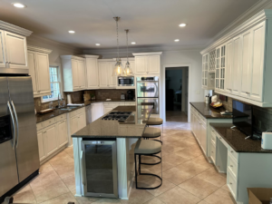 A modern kitchen remodel featuring new cabinets and countertops by Parker Painting Company in Edmond, OK.