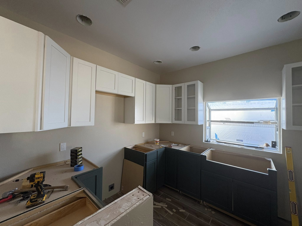 A kitchen remodel showing new upper and lower cabinetry being installed by EJL Construction, LLC in Roswell, NM.
