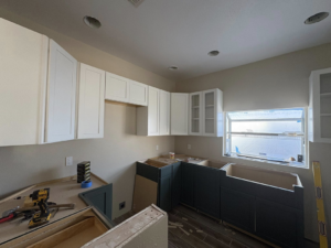 A kitchen remodel showing new upper and lower cabinetry being installed by EJL Construction, LLC in Roswell, NM.