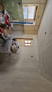 Kitchen remodel in progress with new drywall and cabinet installation by Clausen Construction LLC in Williston, ND
