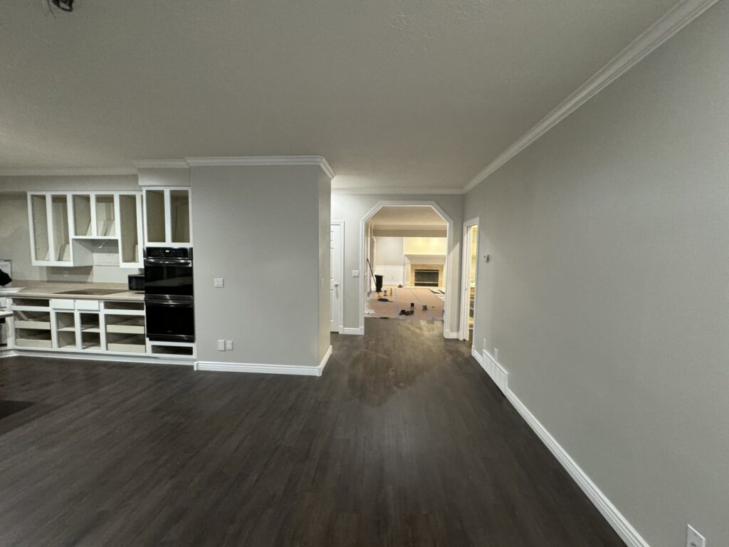 Kitchen and living area remodel with new flooring and cabinet installation by Handyman house repairs and remodeling in Provo, UT