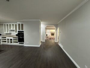 Kitchen and living area remodel with new flooring and cabinet installation by Handyman house repairs and remodeling in Provo, UT