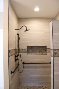 Kitchen remodel with light gray cabinets, white countertops, and a marble backsplash by Prestige Remodeling Solutions in Jackson, TN.