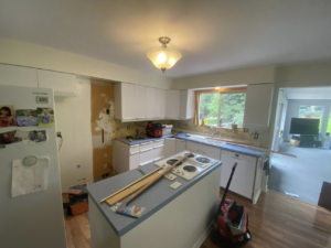 A kitchen remodel in progress, showing exposed walls and new cabinets, by Berg Handyman Services in Post Falls, ID
