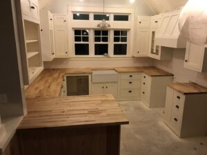 Kitchen remodel in progress with new cabinets and wooden countertops installed by SRP construction in Houston, TX
