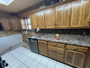 A kitchen remodel in progress showing exposed walls and new appliances by JM Renovations LLC in Moore, OK.