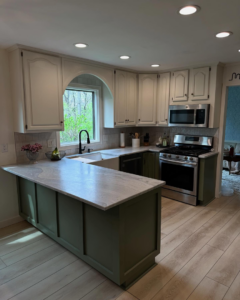 Full view of a kitchen remodel with island and new appliances by True North Builders in Franktown, CO.