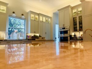 A bright kitchen remodel featuring light-colored cabinets, a large island, and ample natural light by Home Platinum Services, LLC in Plano, TX