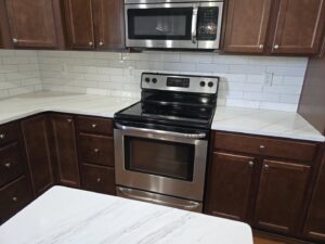 A kitchen remodel with new appliances, countertops, and backsplash by M. Phippin Contracting in Hebron, MD.