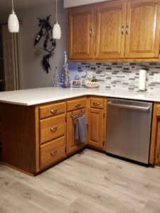 A beautifully remodeled kitchen featuring new countertops and a stylish backsplash by GCB Home Improvement in Appleton, WI.
