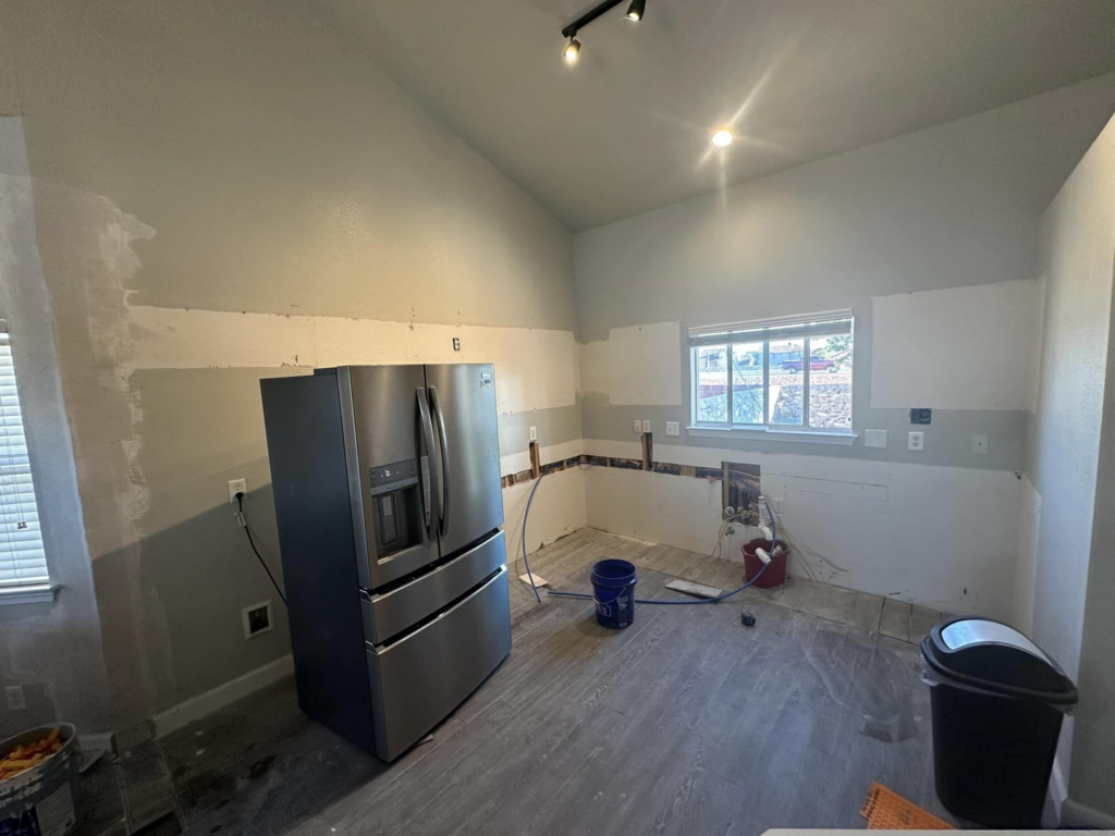 A kitchen remodel under construction with walls prepped for new cabinets by Innovative Design & Construction in Linwood, KS.