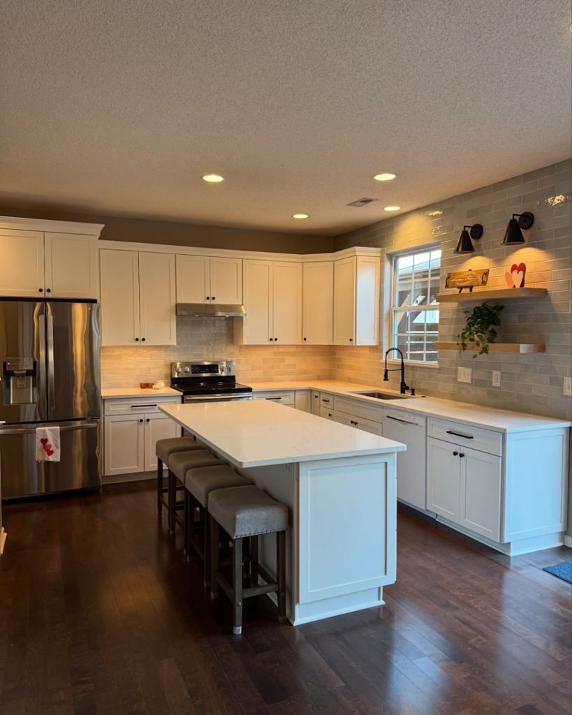 A spacious kitchen remodel featuring a large island and white cabinetry by Special Reserve Contracting in Charlotte, NC.