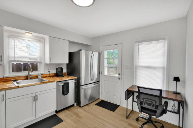 A complete kitchen remodel featuring new stainless steel appliances and wood countertops by Imperial Access Contracting in Evansville, IN.
